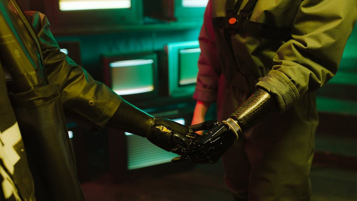 A compelling handshake featuring modern prosthetic arms in an industrial environment.