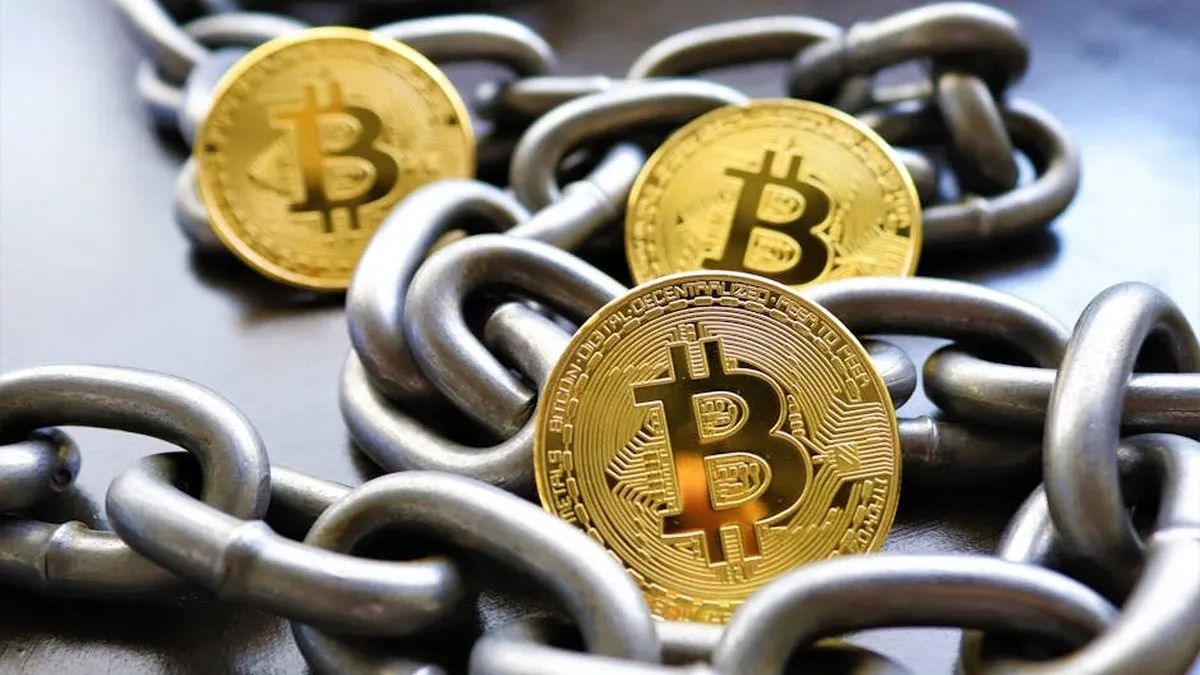Close-up of Bitcoin coins entwined in metallic chains showcasing cryptocurrency security