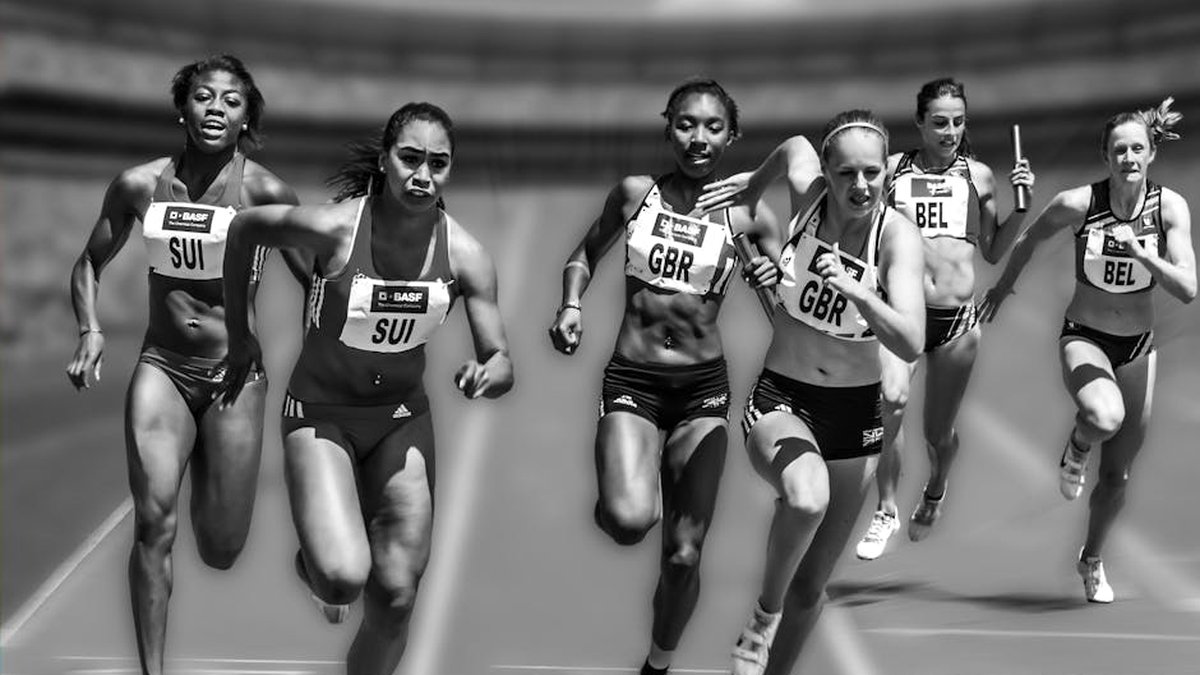Female athletes in a high-stakes track race showcasing physical prowess and competition.